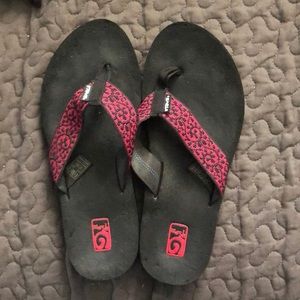 Pink and black Teva flip flops